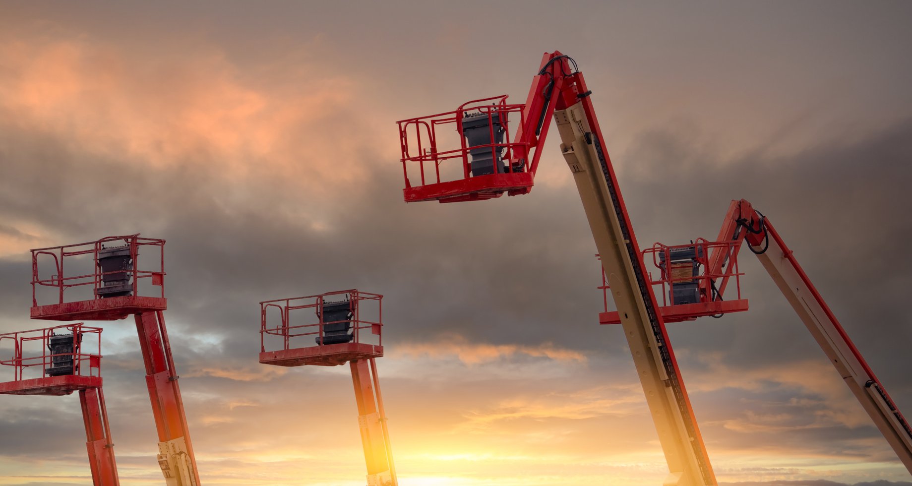 Telescopic Boom Lift with Sunset Sky